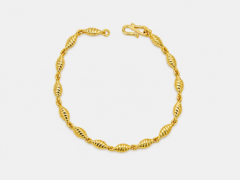 Golden Twisted Oval Bead Bracelet